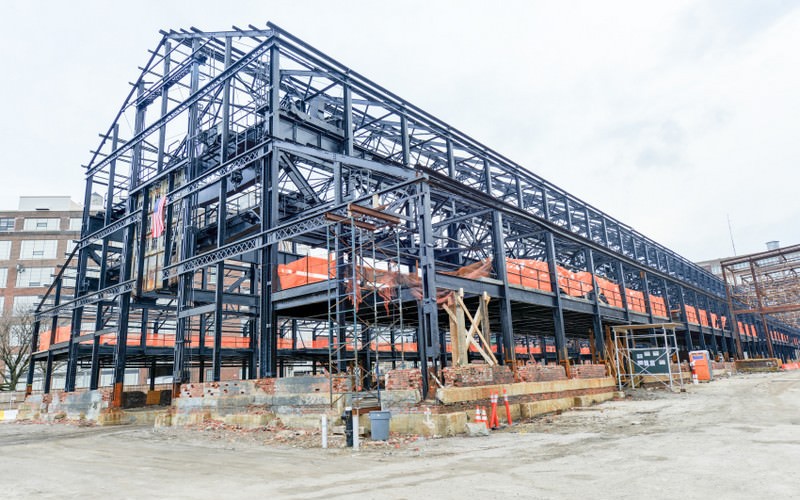 Empty warehouse/factory steel shell under construction.