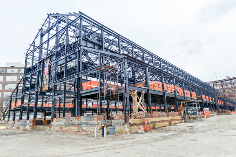 Empty warehouse/factory steel shell under construction.